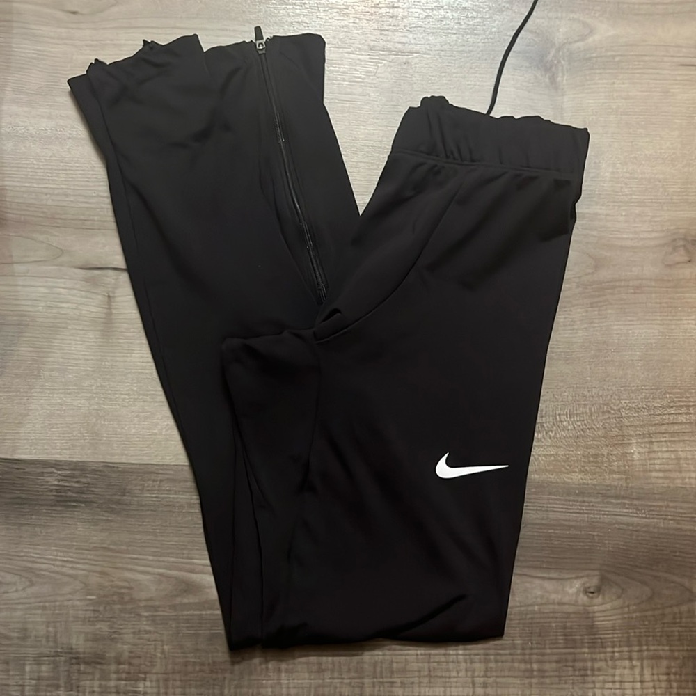 Nike athletic leggings. Ankle zips. Draw string waist. Worn 1 time.